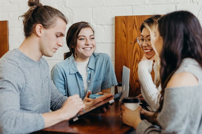 A group of people discuss marketing research