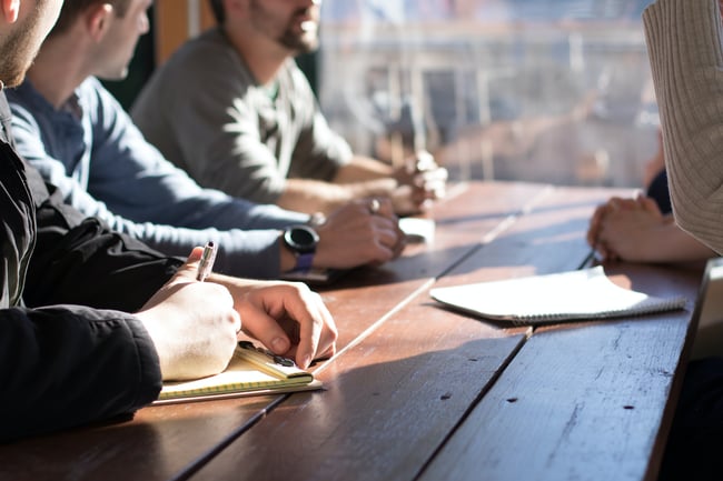 a group of people discuss marketing strategy